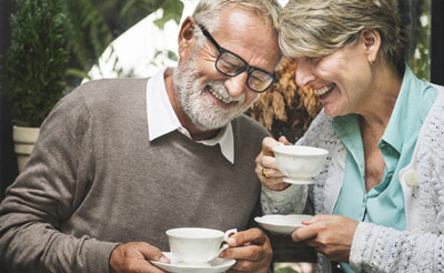 An elderly couple on a date, enjoying each others company